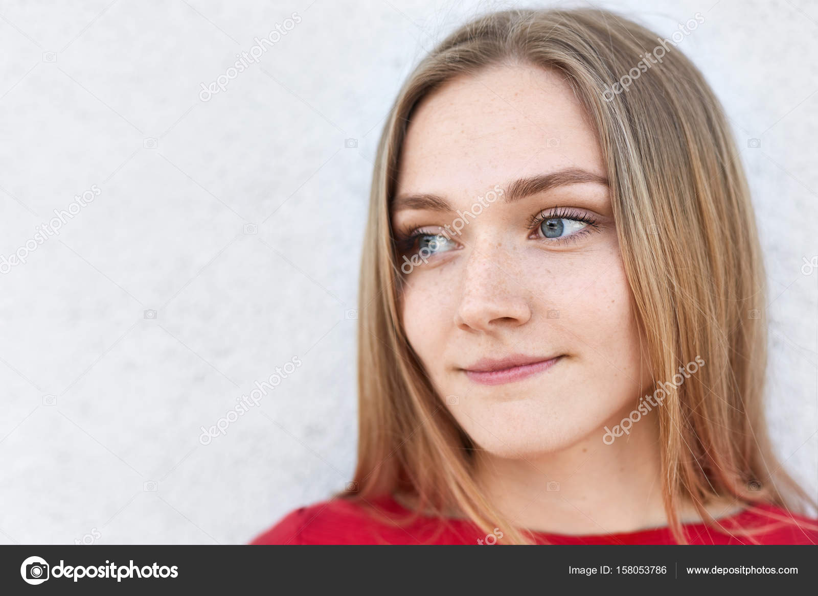 Close Up Portrait Of Pensive Woman With Light Hair Blue Eyes And