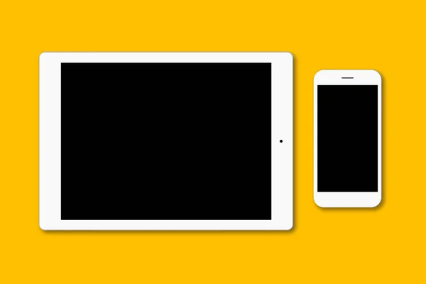 Σύγχρονη έξυπνο τηλέφωνο και ψηφιακό tablet απομονωμένη κίτρινη επιφάνεια. Σύγχρονα gadgets με κενή οθόνη για σας διαφήμιση ή διαφημιστικό κείμενο. Δύο αντικείμενα. Τεχνολογία έννοια — Φωτογραφία Αρχείου