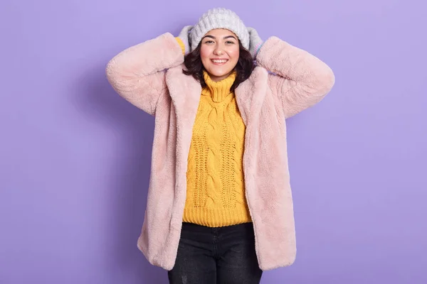 Horizontal indoor picture of joyful adorable young woman putting — Stockfoto