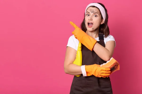 Image Emotional Energetic Attractive Housemaid Making Gesture Showing Direction Forefinger — Stock Photo, Image