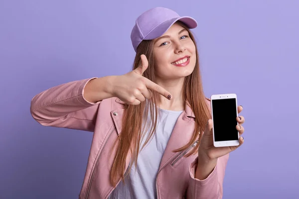 Picture Attractive Charismatic Sweet Girl Pointing Forefinger Device Holding Smartphone — Stock Photo, Image
