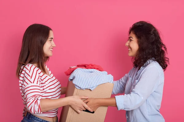 Indoor Shot Two Attractive Women Posing Isolated Rosy Background Smiling — Stock Photo, Image