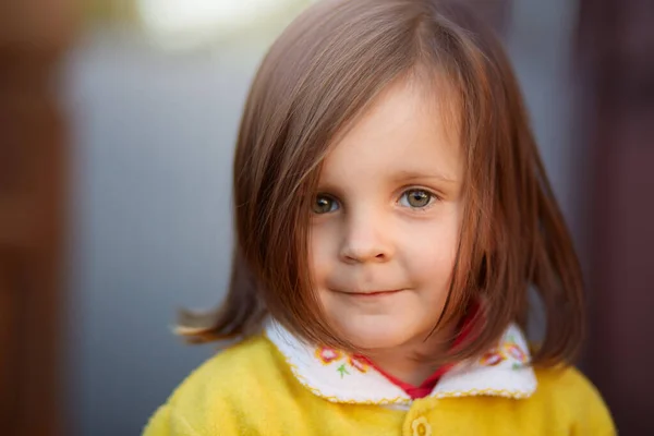 Closeup Portrait Little Charming Girl Looking Directly Camera Wearing Yellow — Stock Photo, Image