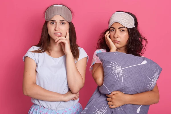 Two Pensive Sleepy Ladies Sleeping Mask Foreheads Standing Pink Wall — Stock Photo, Image