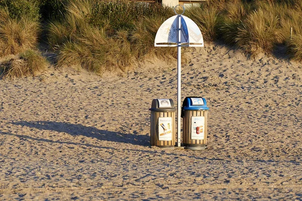 Two garbage bin for recycling on sand — Stock Photo, Image