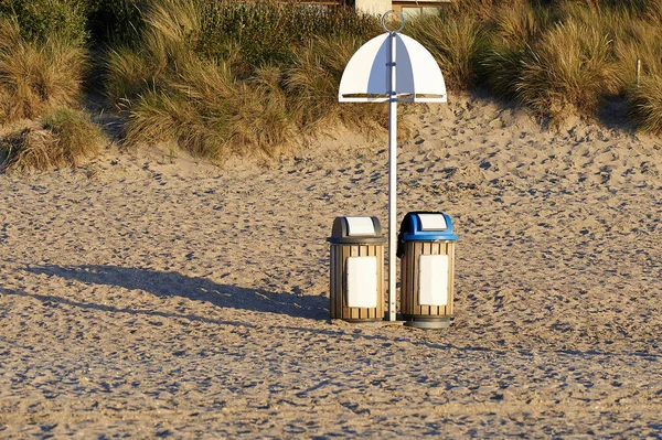 Two garbage bin for recycling on sand — Stock Photo, Image