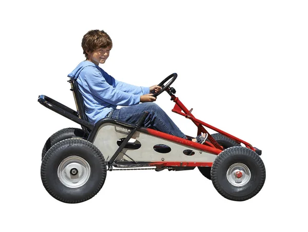 Ung pojke köra en fyrhjuling — Stockfoto