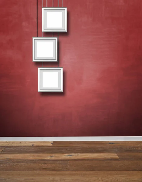 Red textured wall and Alu frames hanging — Stock Photo, Image