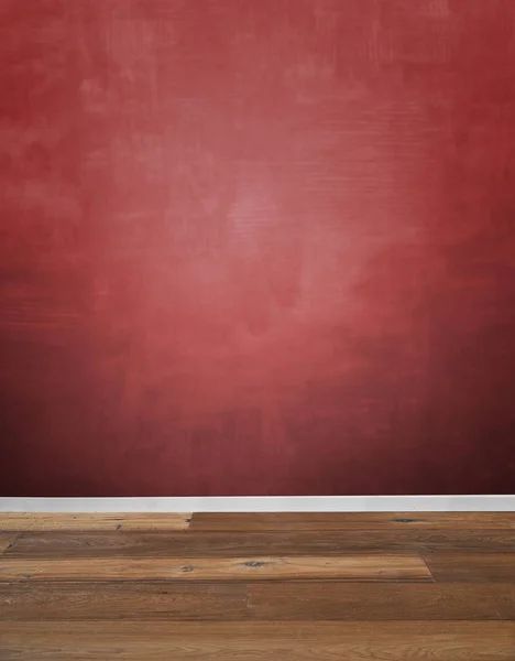 Rød tekstureret væg og trægulv - Stock-foto