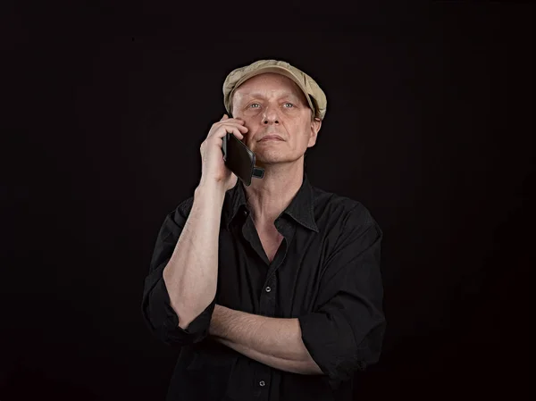 Portrait of a serious person with his smartphone — Stock Photo, Image