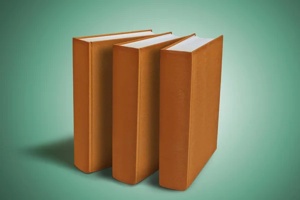 Three Closed big book with hardcover on green gradient backgroun