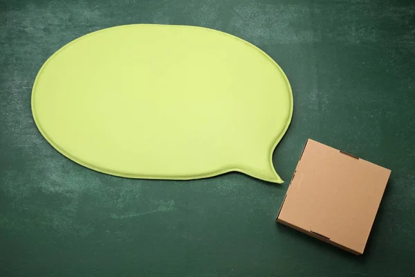 Speech bubble and brown box — Stock Photo, Image