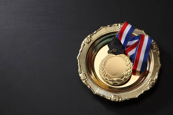Sports medal in tray — Stock Photo, Image