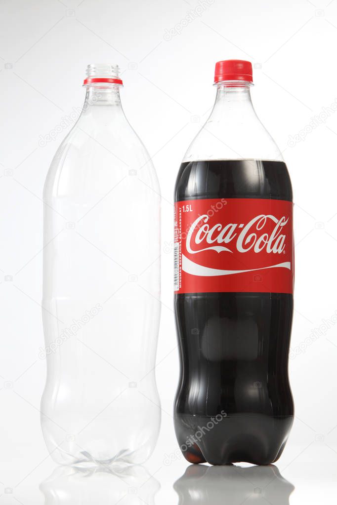 Kuala Lumpur, Malaysia - 18th July 2016: 1.5l coca cola drink and empty bottle on the white background