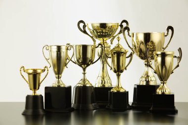 different golden trophies clipart
