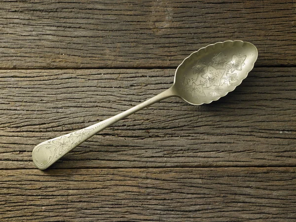 Lepel op houten tafel — Stockfoto