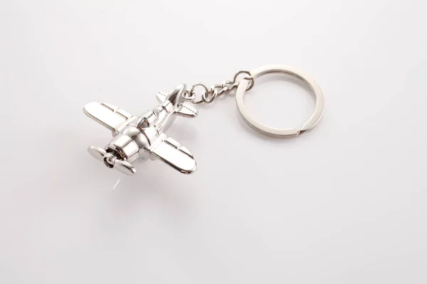 Silver air plane key chain — Stock Photo, Image