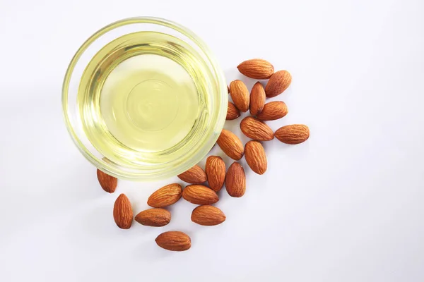 Almonds oil and seeds — Stock Photo, Image