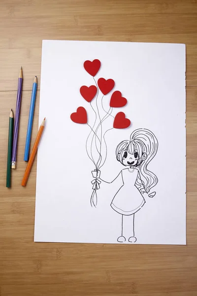 Menina segurando balões em forma de coração — Fotografia de Stock