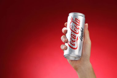 Hand holds can of Coca-Cola     clipart
