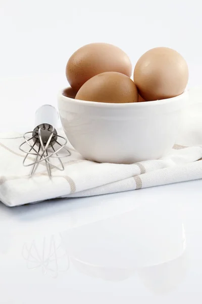 Eggs in white bowl — Stock Photo, Image