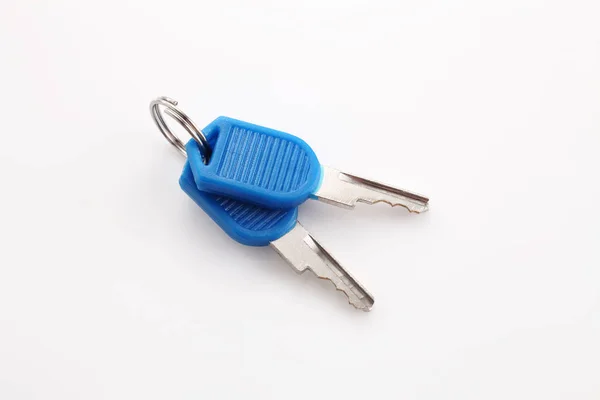 Modrá barva zavazadla klíče — Stock fotografie