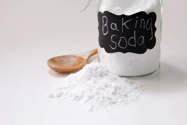 Baking soda in jar and spoon — Stok Foto