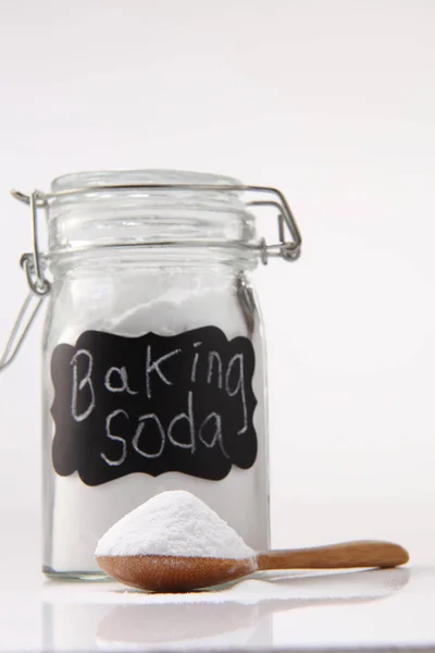 Baking soda in jar and spoon — Stok Foto