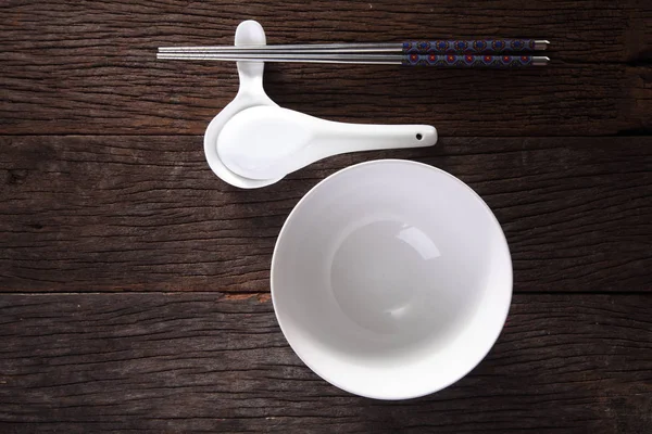 Bowl, spoon and chopsticks — Stock Photo, Image