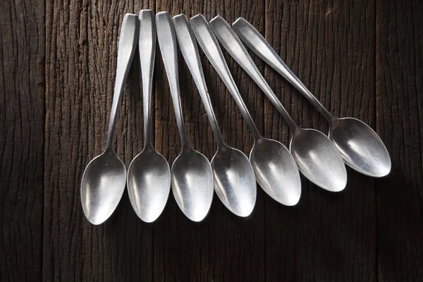 Aluminum spoons on table — Stock Photo, Image