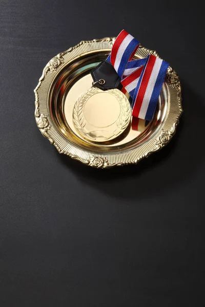 Sports medal in tray — Stock Photo, Image