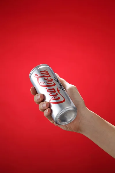 Hand holding Coca-Cola light — Stock Photo, Image
