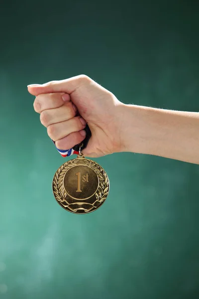 Hand holding medal — Stock Photo, Image