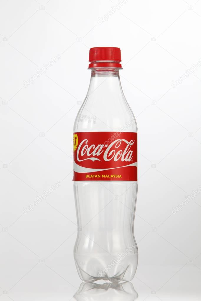 Kuala Lumpur, Malaysia - 18th July 2016: Empty coca cola plastic bottle on the white background