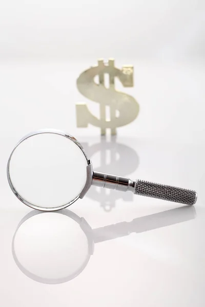 Magnifier glass with dollar sign — Stock Photo, Image