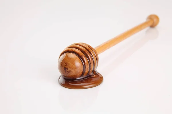 Honey and wooden dipper — Stock Photo, Image