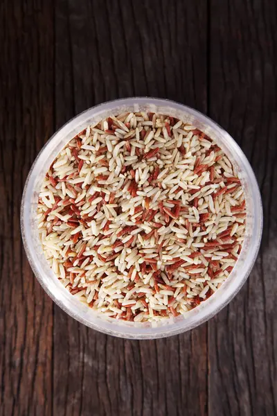 Raw rice in bowl — Stock Photo, Image