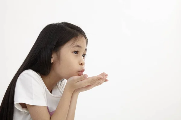 Linda Niña Soplando Beso Sobre Blanco —  Fotos de Stock