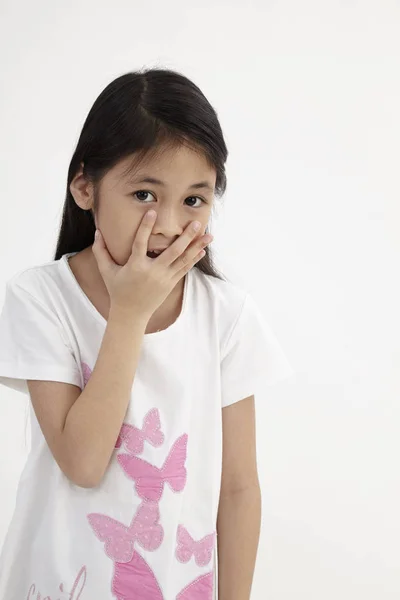 Cute Little Girl Covering Her Mouth Showing Intense Expression Fear — Stock Photo, Image