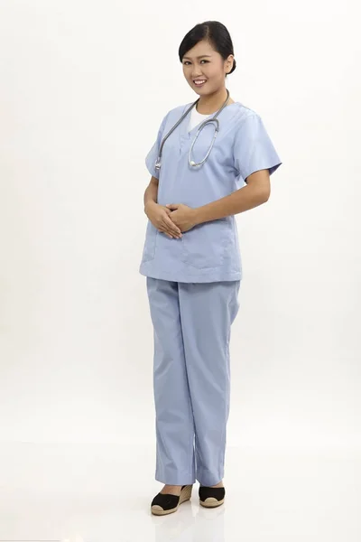 Enfermera Con Uniforme Azul Sobre Fondo Blanco —  Fotos de Stock