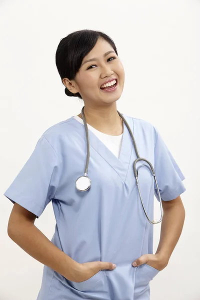 Enfermeira Com Uniforme Azul Fundo Branco — Fotografia de Stock