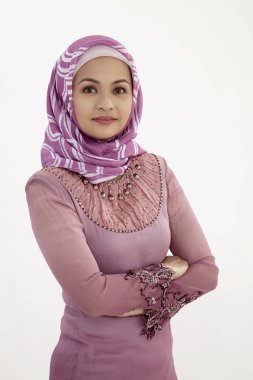 malay woman crossed arms on the white background clipart