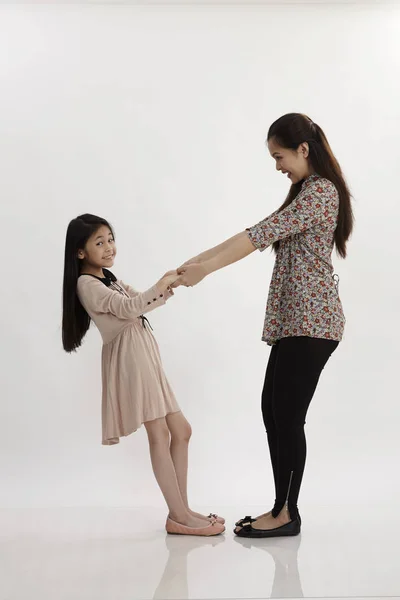 Mother Daughter Pulling Each Other Posing Studio — Stock Photo, Image