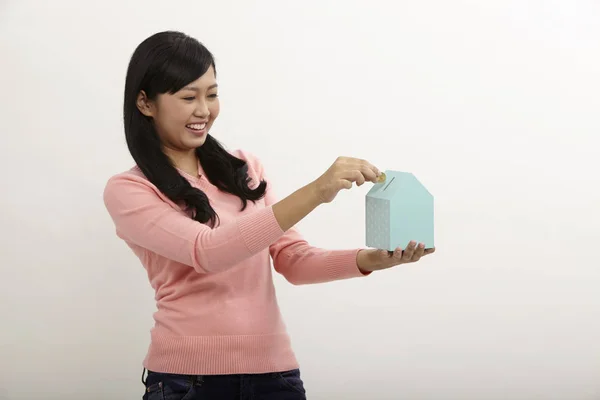 Woman Holding House Shape Coin Box White Background — Stock Photo, Image