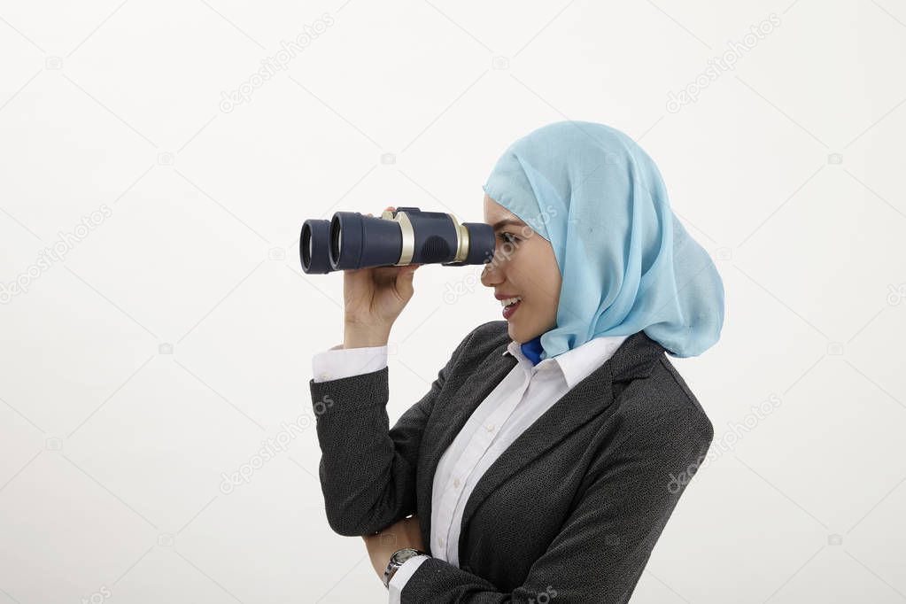 malay business woman looking through binocullars