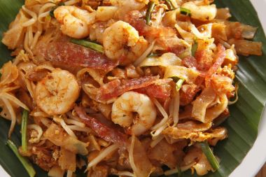Top view of malaysian famous food Penang fried kuey teow clipart