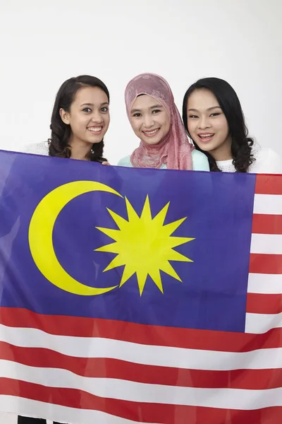 Malaysian Girls Holding Big Flag Posing Studio — Stock Photo, Image