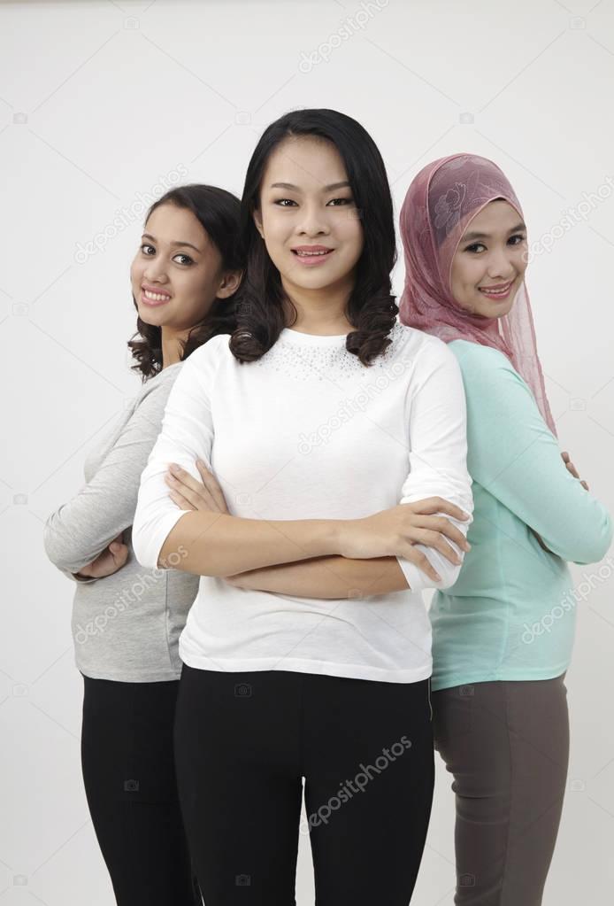 Malaysian three multi racial looking at camera