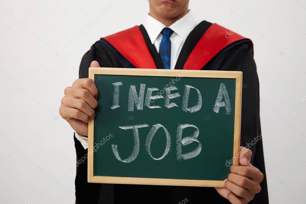 malay graduated student holding a blackboard written need a job 