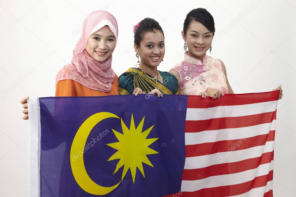 young women holding malaysian flag